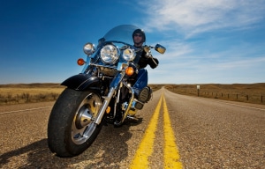 image of a man riding a motorcycle — motorcycle safety tips for new owners